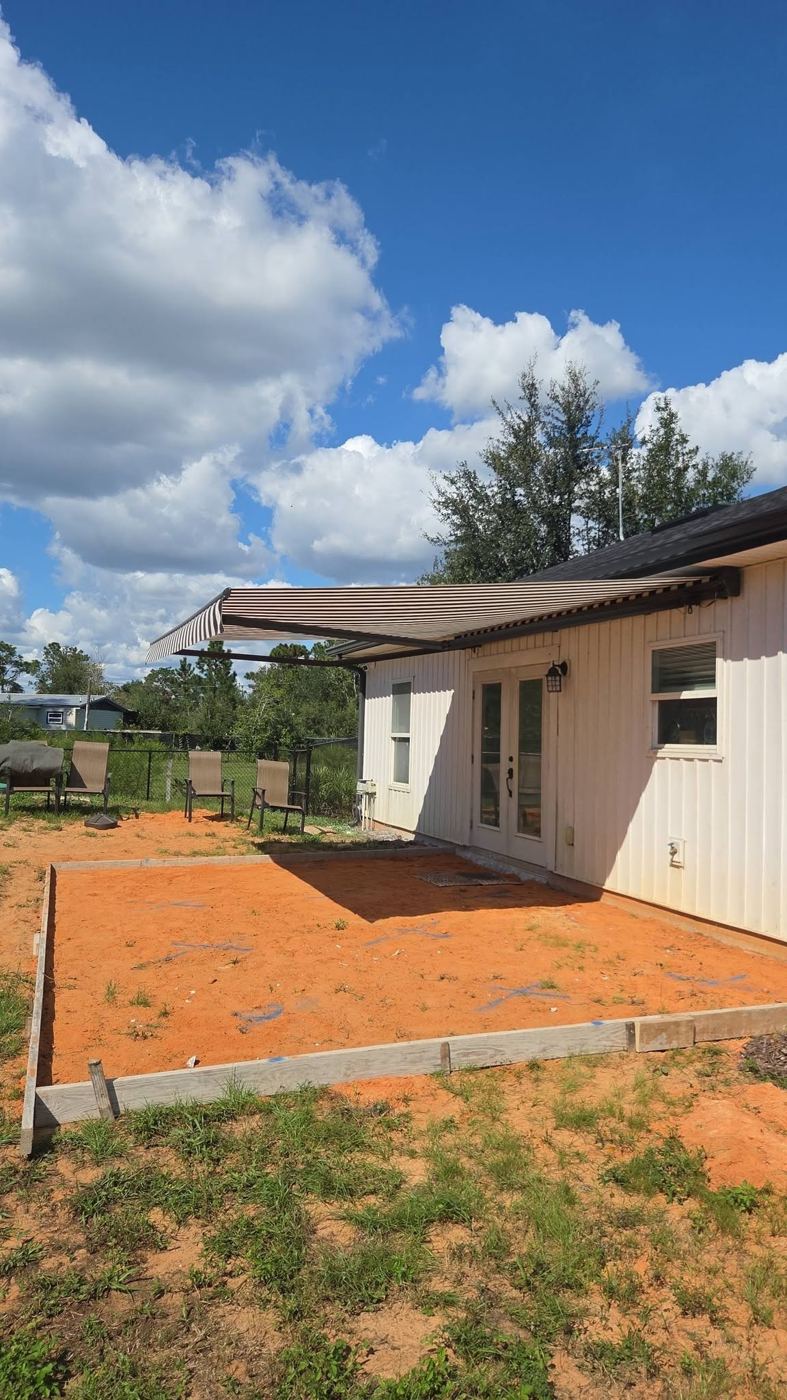 Concrete pad poured beside a home